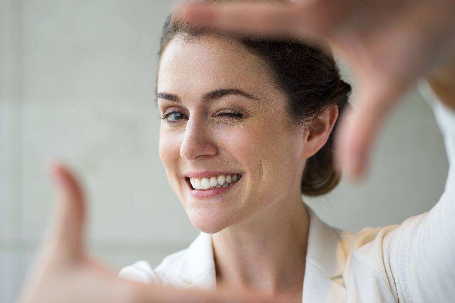 Woman smiling confidently with healthy teeth.