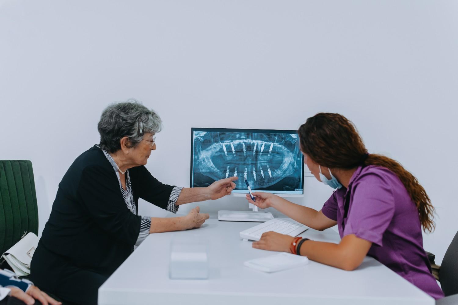 Dentist and patient discussing dental treatment