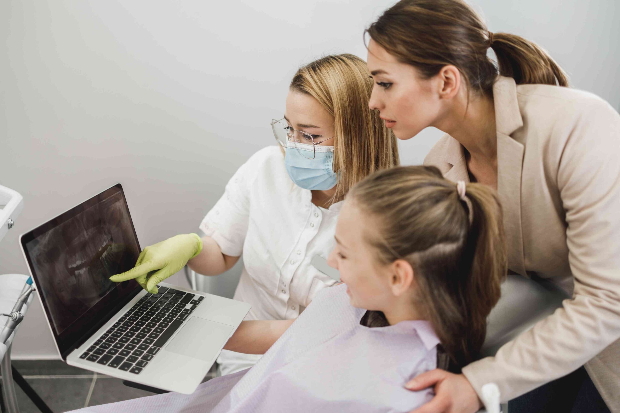 Dentist reviewing X-rays with a patient.